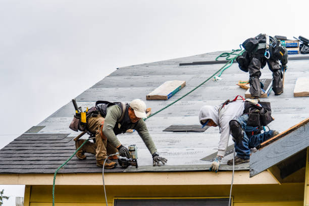 Professional Roofing technician working in Hollis, NY